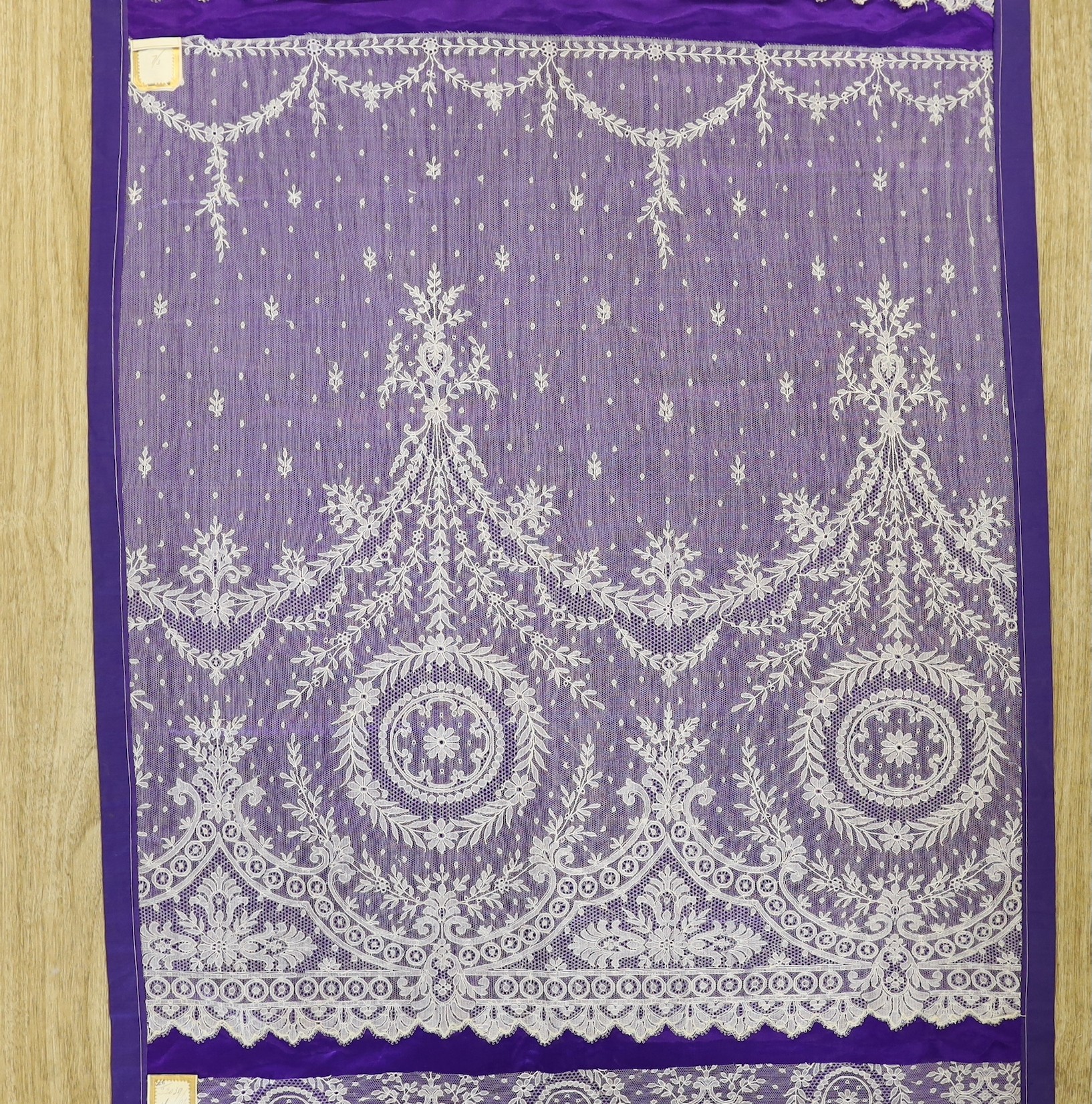 A late 19th, early 20th century retail sample display of various lace designs